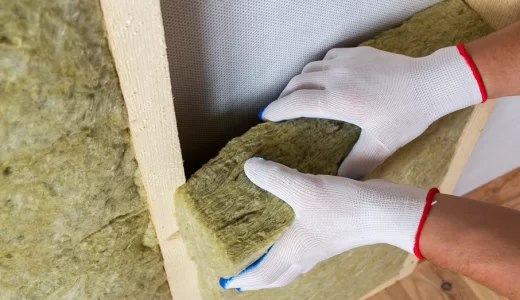 close-up-worker-hands-white-gloves-insulating-rock-wool-insulation-staff-wooden-frame-future-walls-cold-barrier-comfortable-warm-home-economy-construction-renovation-concept