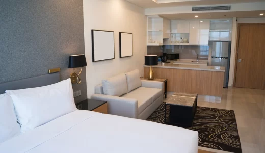 hotel-room-interior-with-bedroom-area-living-space-kitchen